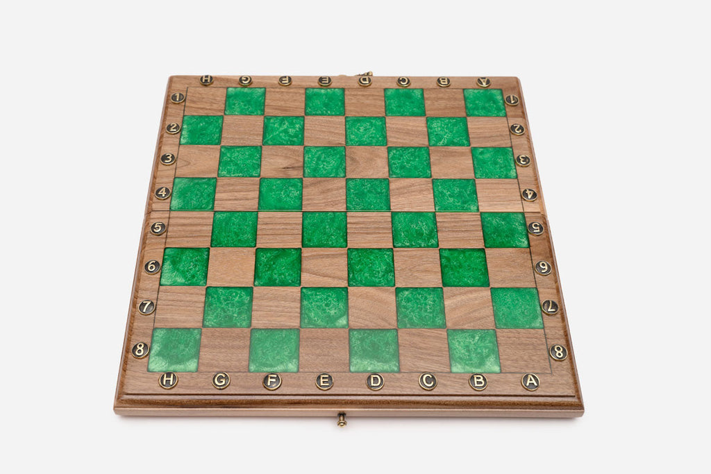 Angled view of the small green epoxy chess set
