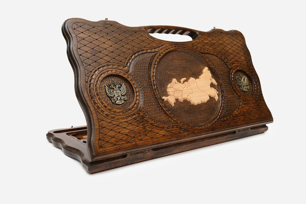 Carved Russian backgammon board with the map of Russia, bronze eagles and a cut-out carry handle, propped open