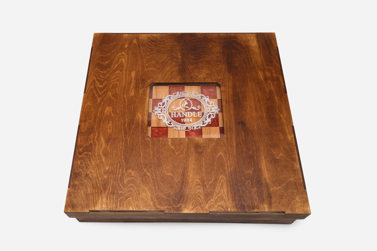 The red epoxy chess set shown set up for play