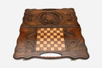 Angled view of the handmade Armenian backgammon set showing the carved emblem