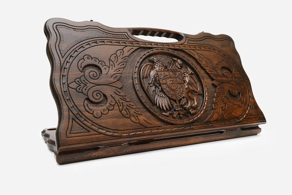 Carved Armenian backgammon board with the emblem of Armenia and a cut-out carry handle, propped open