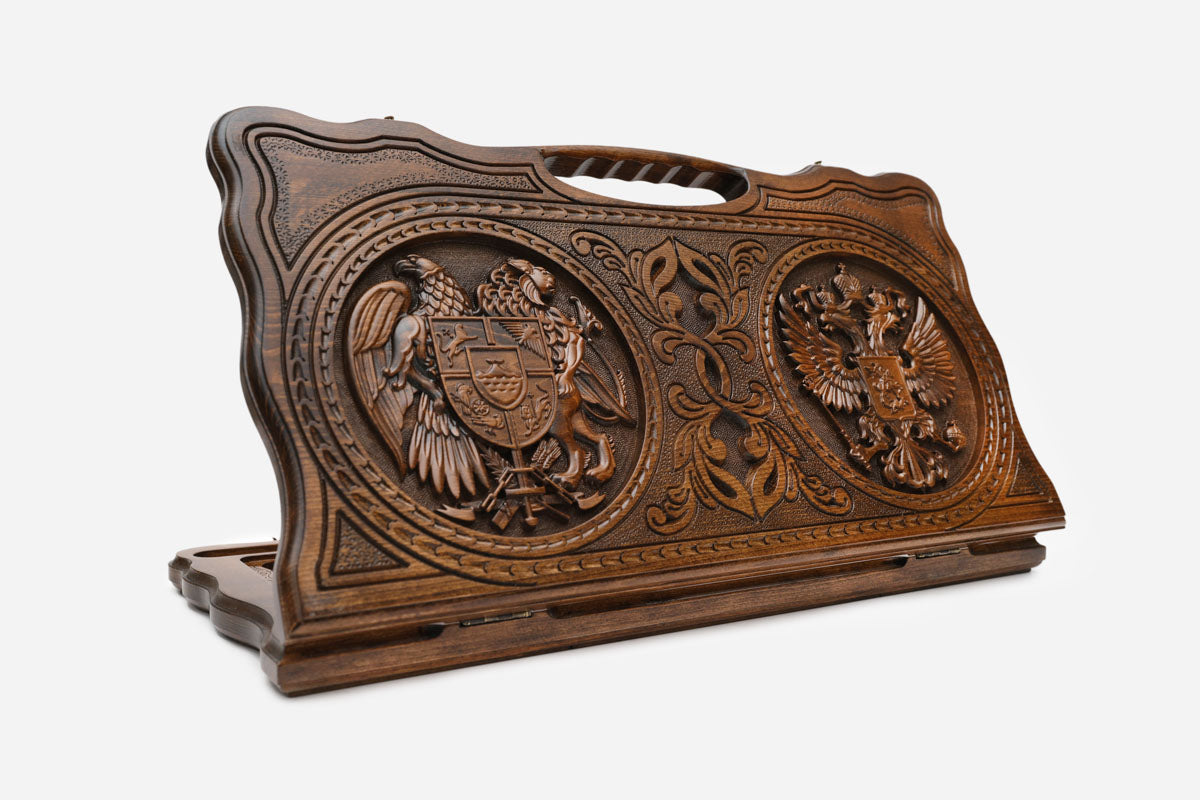 Carved Armenian backgammon board with the Armenian and Russian coats of arms and a cut-out carry handle, propped open