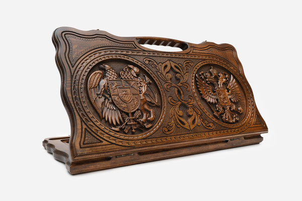 Carved Armenian backgammon board with the Armenian and Russian coats of arms and a cut-out carry handle, propped open