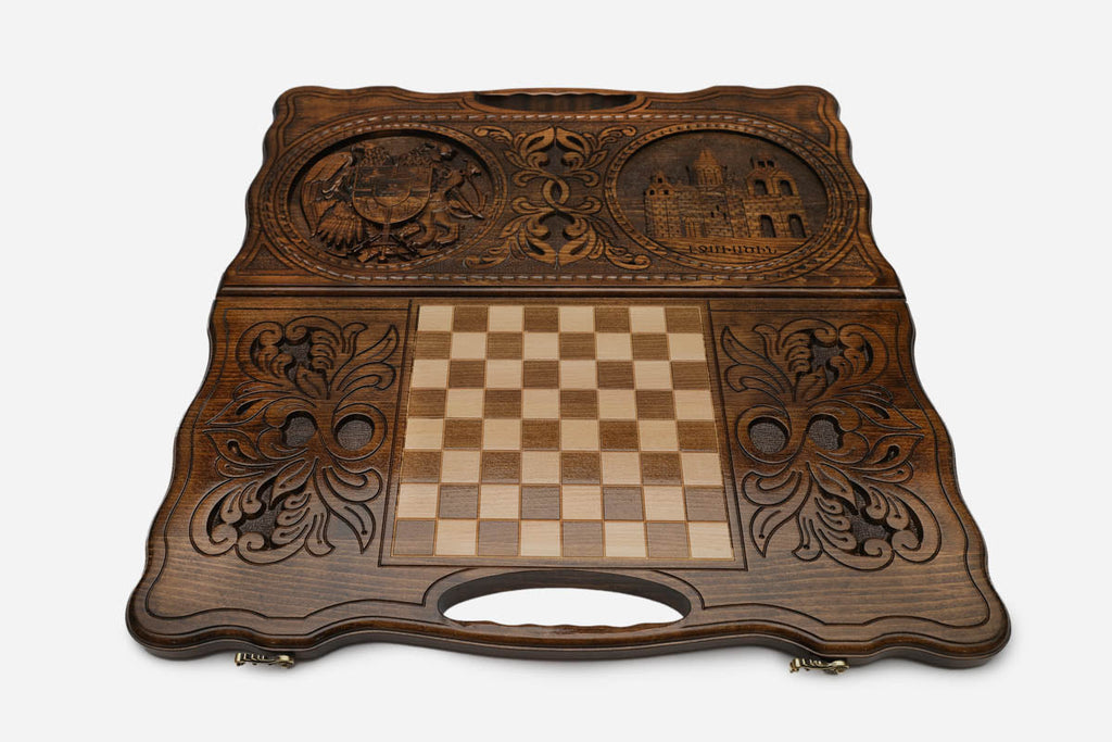 Angled view of the handmade Armenian backgammon set showing both carvings on the lid
