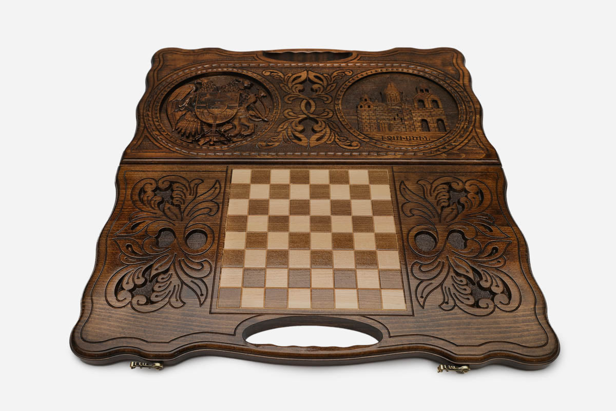 Angled view of the handmade Armenian backgammon set showing both carvings on the lid