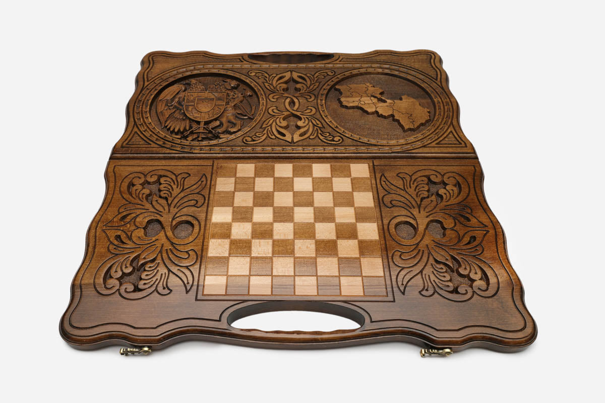 Angled view of the handmade Armenian backgammon set showing both carvings