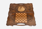Angled view of the handmade Georgian backgammon set showing the carved lid