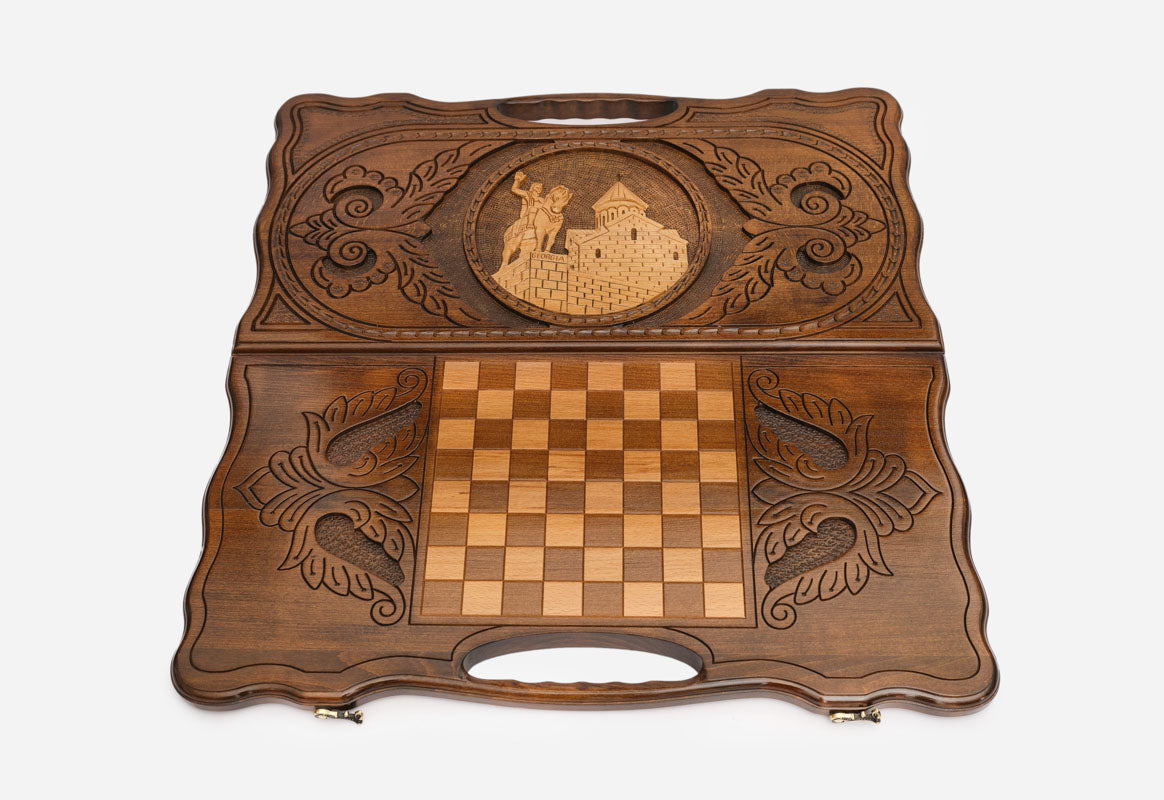 Angled view of the handmade Georgian backgammon set showing the carved lid