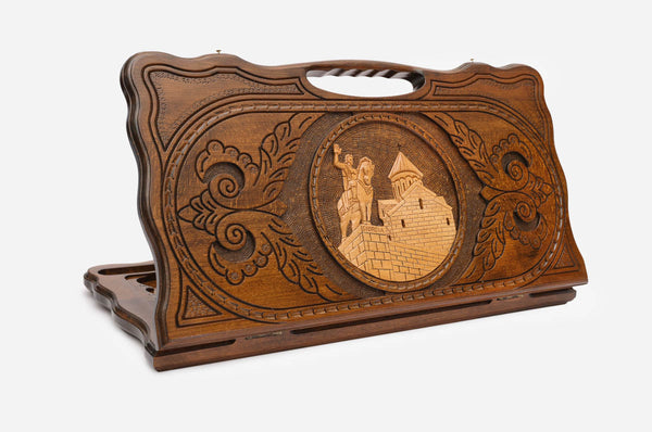 Carved Georgian backgammon board with King Vakhtang Gorgasali on horseback and a cut-out carry handle, propped open