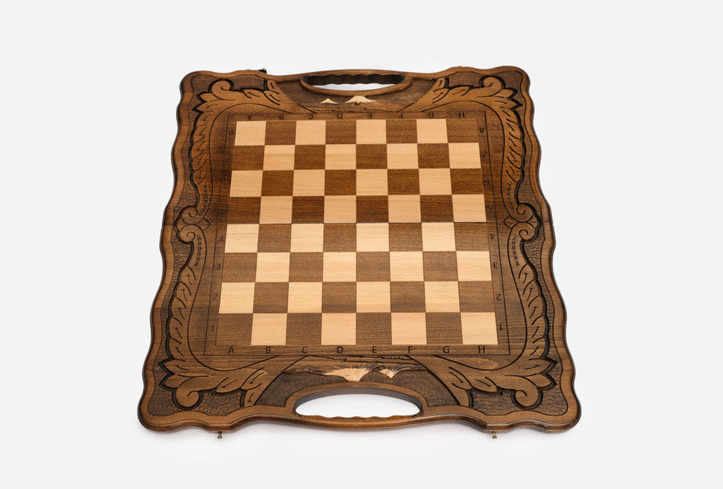 Overhead view of the full set of 32 wooden pieces in starting position