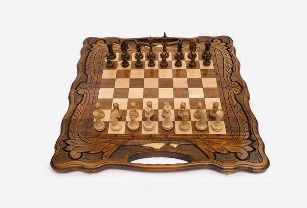 Luxury Armenian walnut chess set with a Mount Ararat inlay and carved leaf borders, set up with wooden pieces