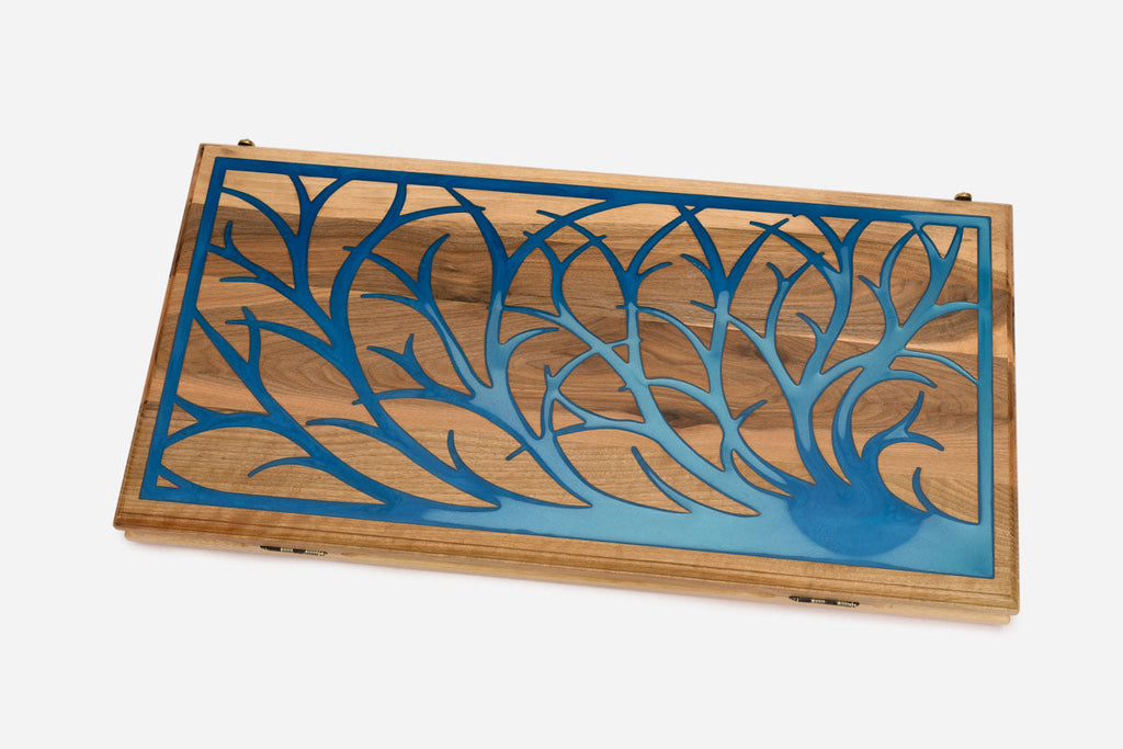 Close-up of the blue epoxy branches set into the walnut