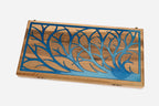 Close-up of the blue epoxy branches set into the walnut