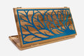 Walnut backgammon board with a tree of life filled in blue epoxy resin, propped open