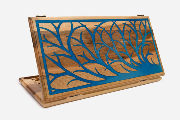 Walnut backgammon board with a tree of life filled in blue epoxy resin, propped open