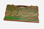 Close-up of the green epoxy branches set into the walnut
