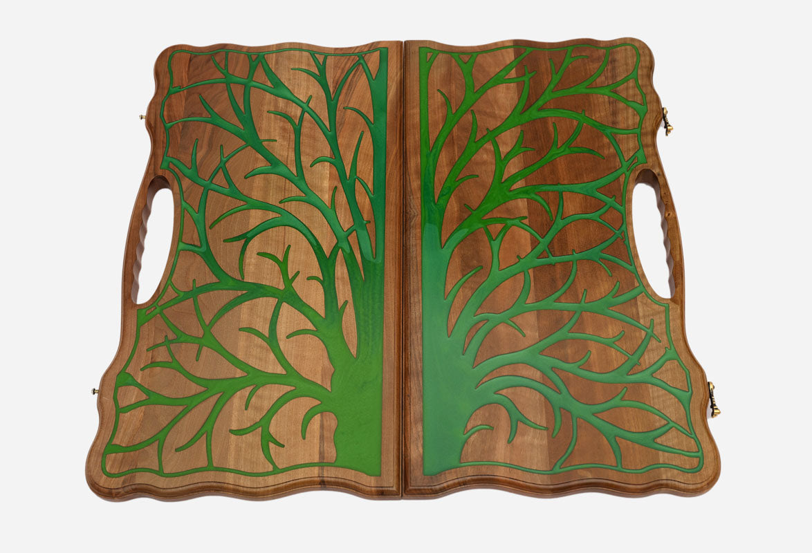 Angled view of the luxury walnut epoxy backgammon set with its carry handle
