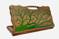 Walnut backgammon board with a green epoxy tree of life and a cut-out carry handle, standing upright