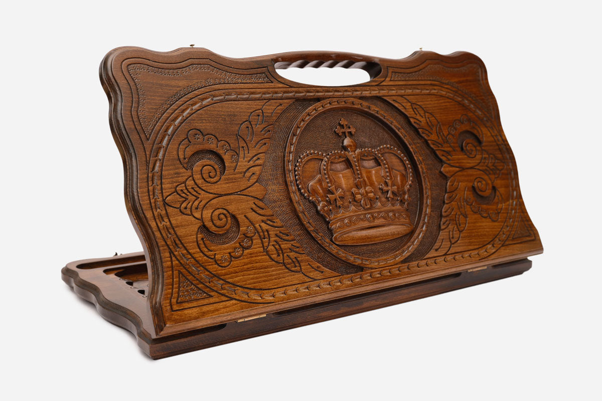 Carved beechwood backgammon board with a royal crown and carry handle, propped open