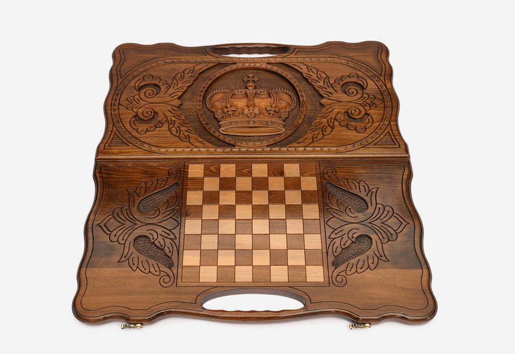 The backgammon board opened to show the wooden playing surface