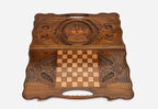 The backgammon board opened to show the wooden playing surface
