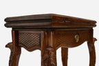Close-up of the carved eagle head on the backgammon table lid