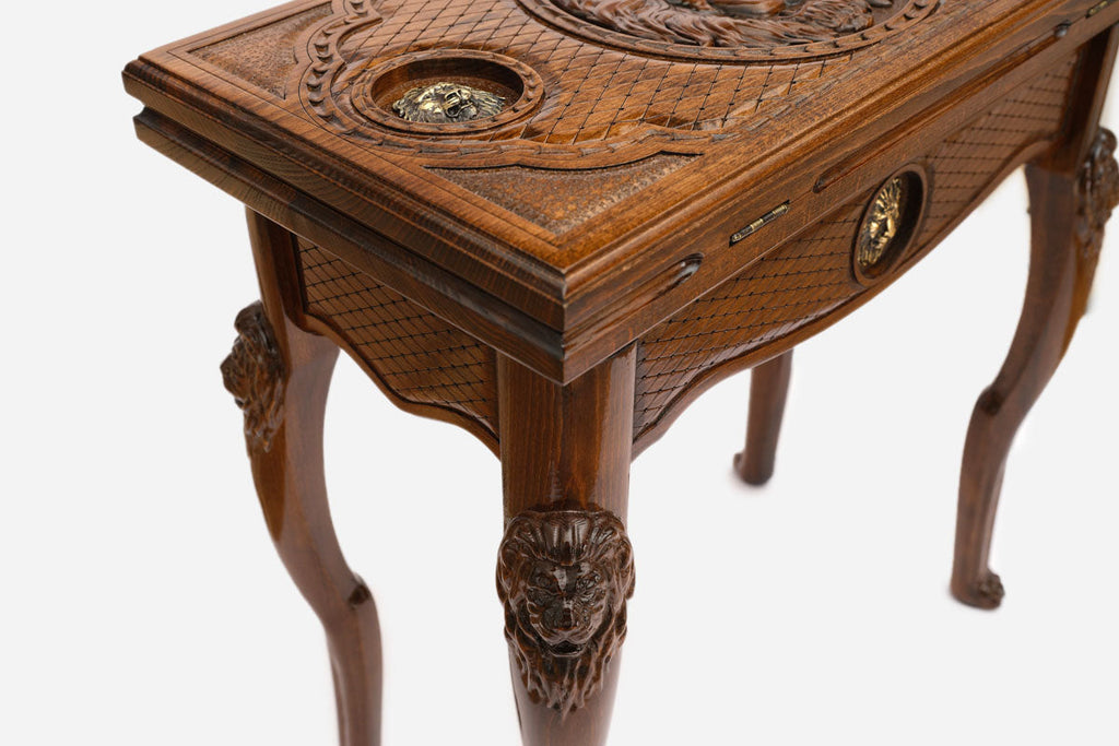Lion backgammon table closed, front view showing the carved lion head on the lid