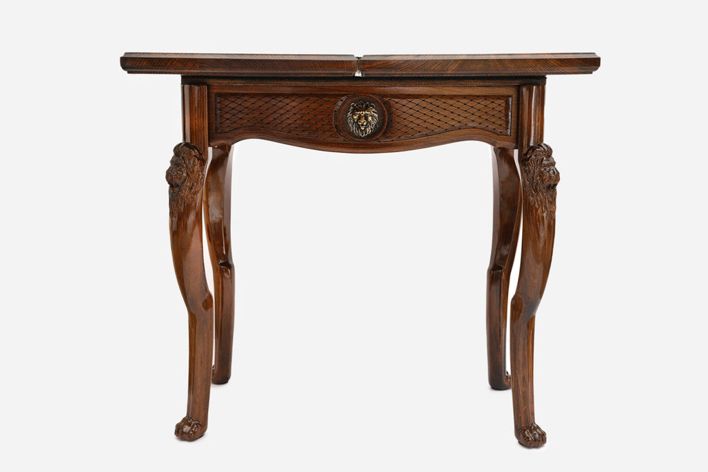 Close-up of the carved lion leg and paw foot on the backgammon table