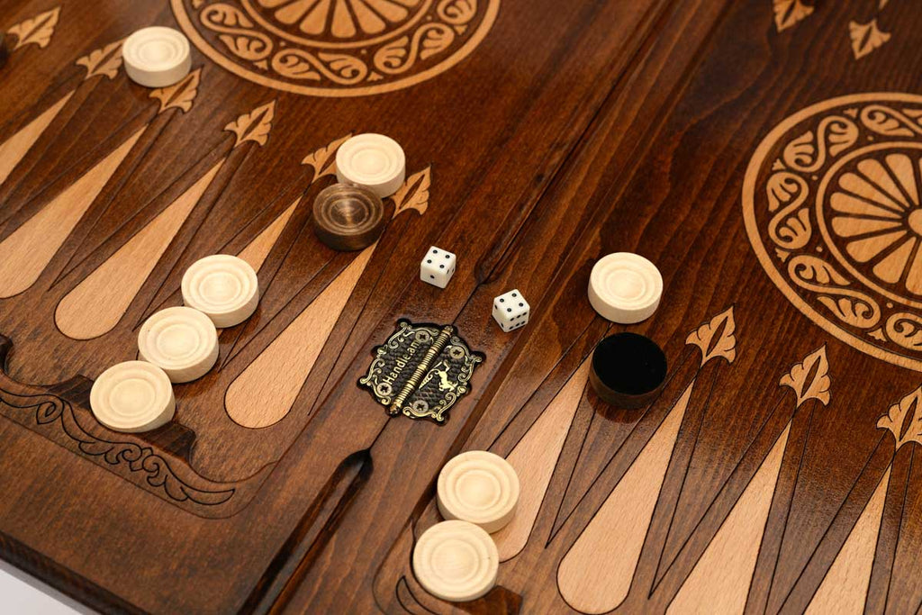 Close-up of the checkers, dice and cup on the lion backgammon table