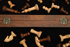 Walnut and beech chess board, carved border detail