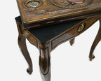 Close-up of the bronze pomegranate at the centre of the backgammon table lid