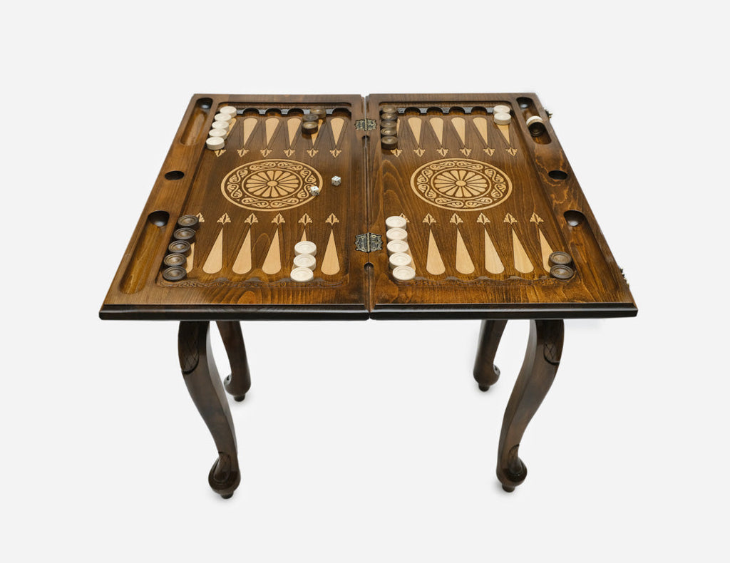 Bronze pomegranate backgammon table closed, angled view of the carved cabriole legs