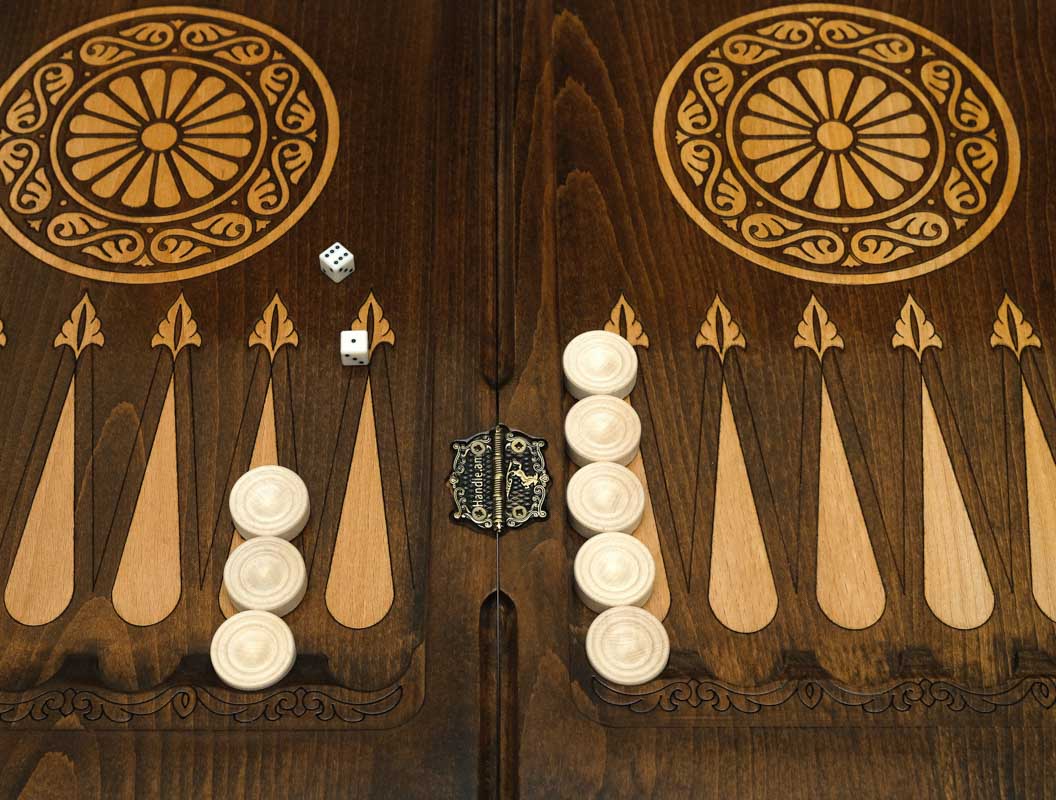 Pomegranate backgammon table opened flat with bronze-topped checkers, top-down view