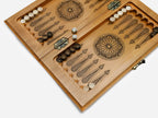 Close-up of the hand-carved arch border and the coordinate markers along the edge