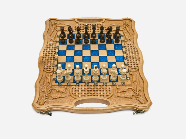 Luxury blue epoxy chess set with royal-blue squares, carved borders and turned wooden pieces set up for play