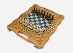 Overhead view of the full set of light and dark wooden pieces on the blue epoxy board