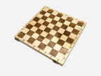 Folding wooden chess set with bronze clasps