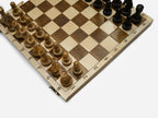 Close-up of the carved border on the beech chess board