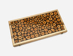 Detail of the log-slice mosaic and walnut frame
