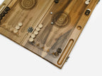 The wood-slice epoxy backgammon board opened for play