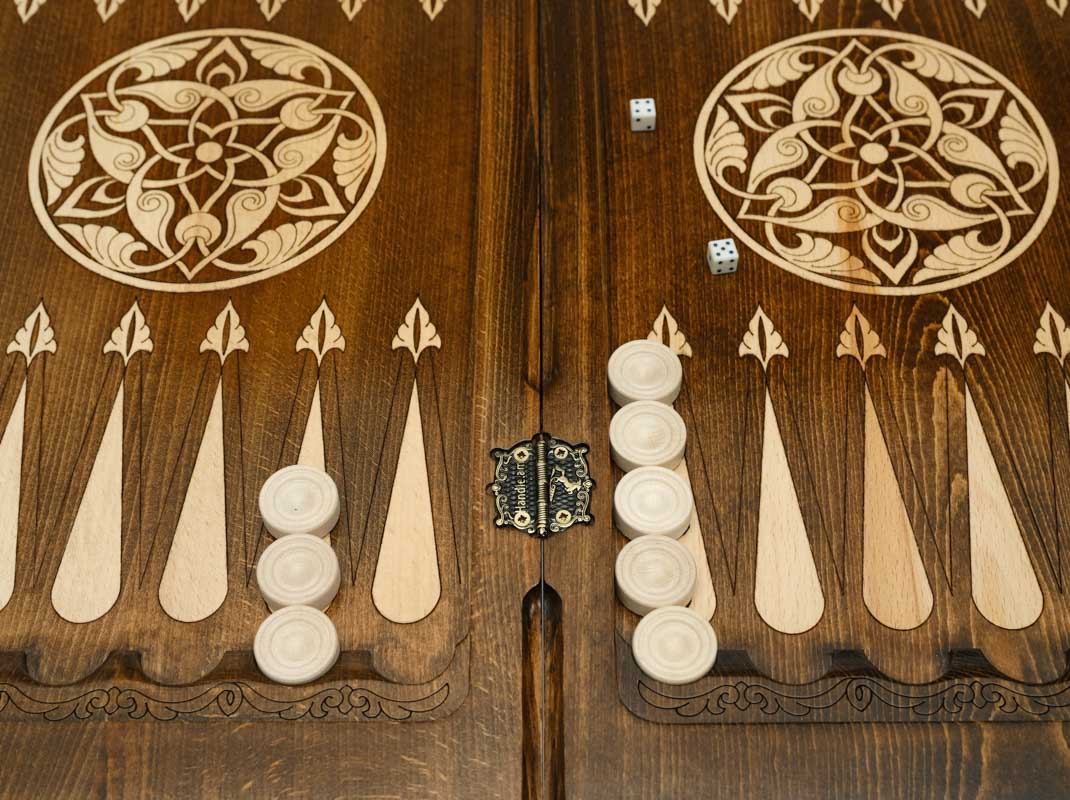 Rearing horses backgammon table opened flat with checkers set up, top-down view