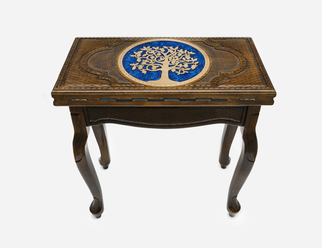 Close-up of the carved Tree of Life picked out with blue epoxy