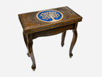 The table shown closed, with the hand-carved Tree of Life on the top