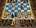 Overhead view of the blue epoxy playing field and its beech and walnut chess pieces