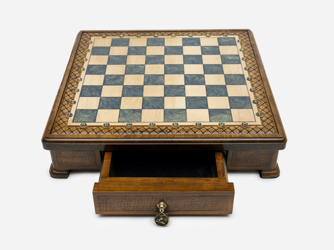 Gray epoxy chess set set up for play, angled view