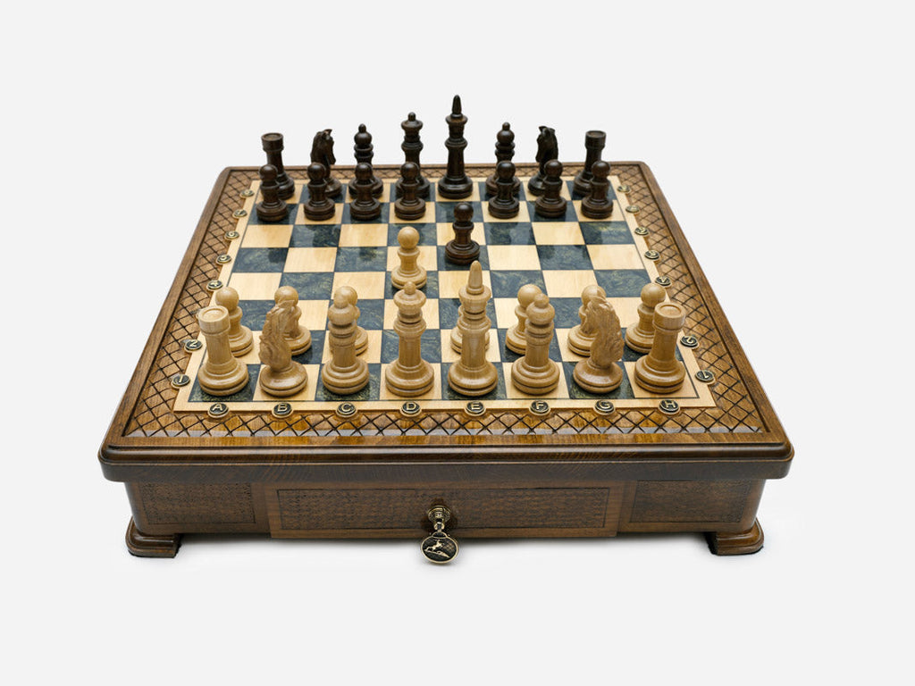 Gray epoxy chess set with wood pieces set up for play, front view