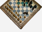 Gray epoxy chess set, angled top-down view of the board and pieces