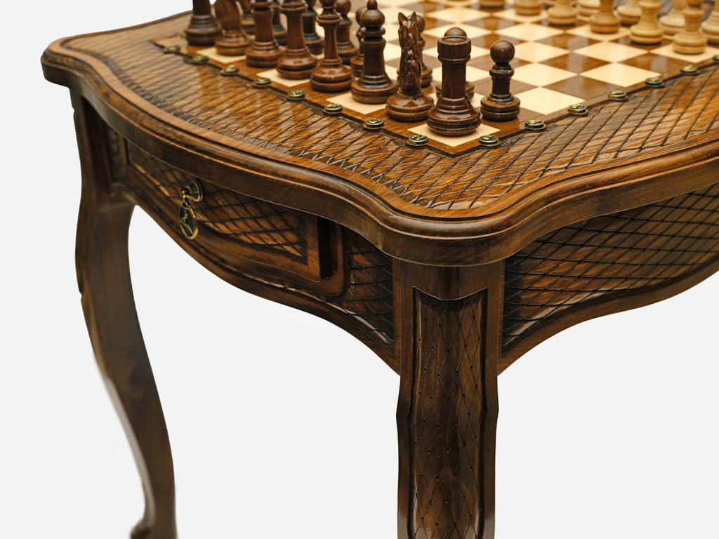 Carved chess table, playing surface detail
