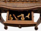 Chess table with carved ornaments, side profile