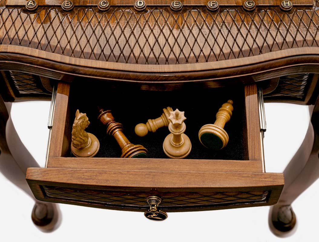 Chess table with carved ornaments, side profile